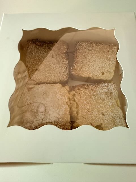 Coconut-dusted square pastries